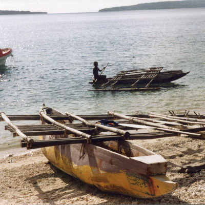 Outrigger canoes on a beach