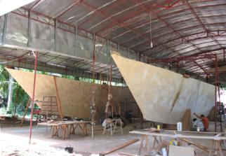 Large catamaran hulls under a roof