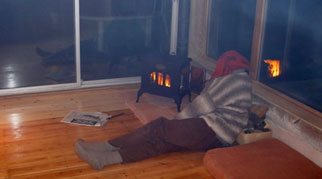 James sat next to a wood burning stove
