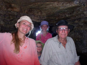 James and his friends, one adult and two children, inside a cave