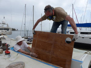 Paul and Hanneke lowering the deckpod panel in place