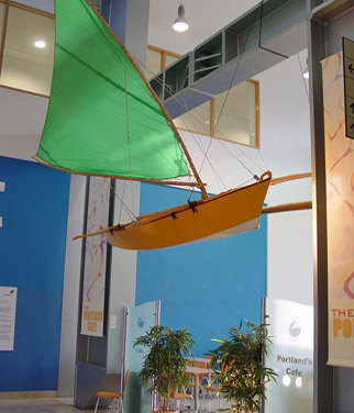 Outrigger canoe suspended from ceiling