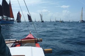 Amatasi sailing alongside other traditional boats
