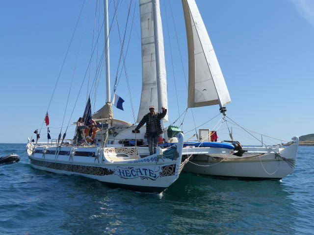 Pahi 52 Hecate with skipper Matt Knight standing on bow