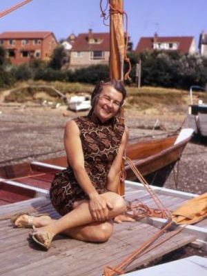 Ruth Wharram on a beached catamaran
