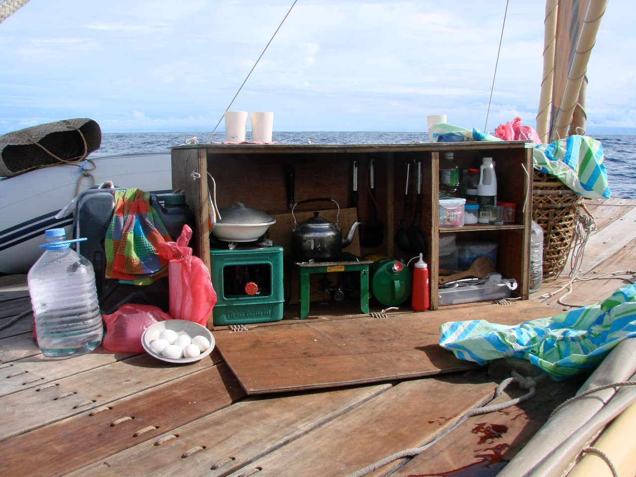 Small kitchen in a box, on the deck of a boat