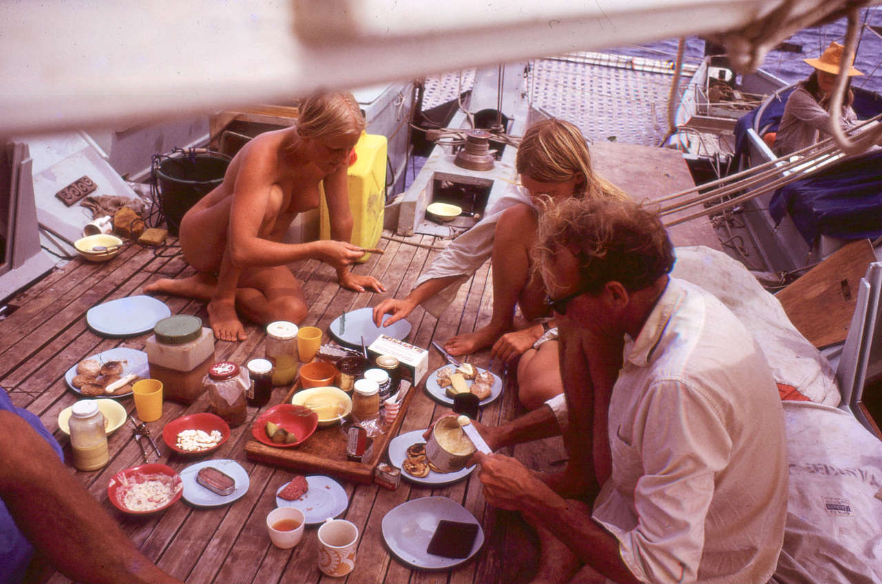Three people having lunch on deck