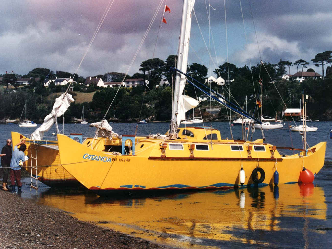Yellow Pahi 42, beached in a harbour