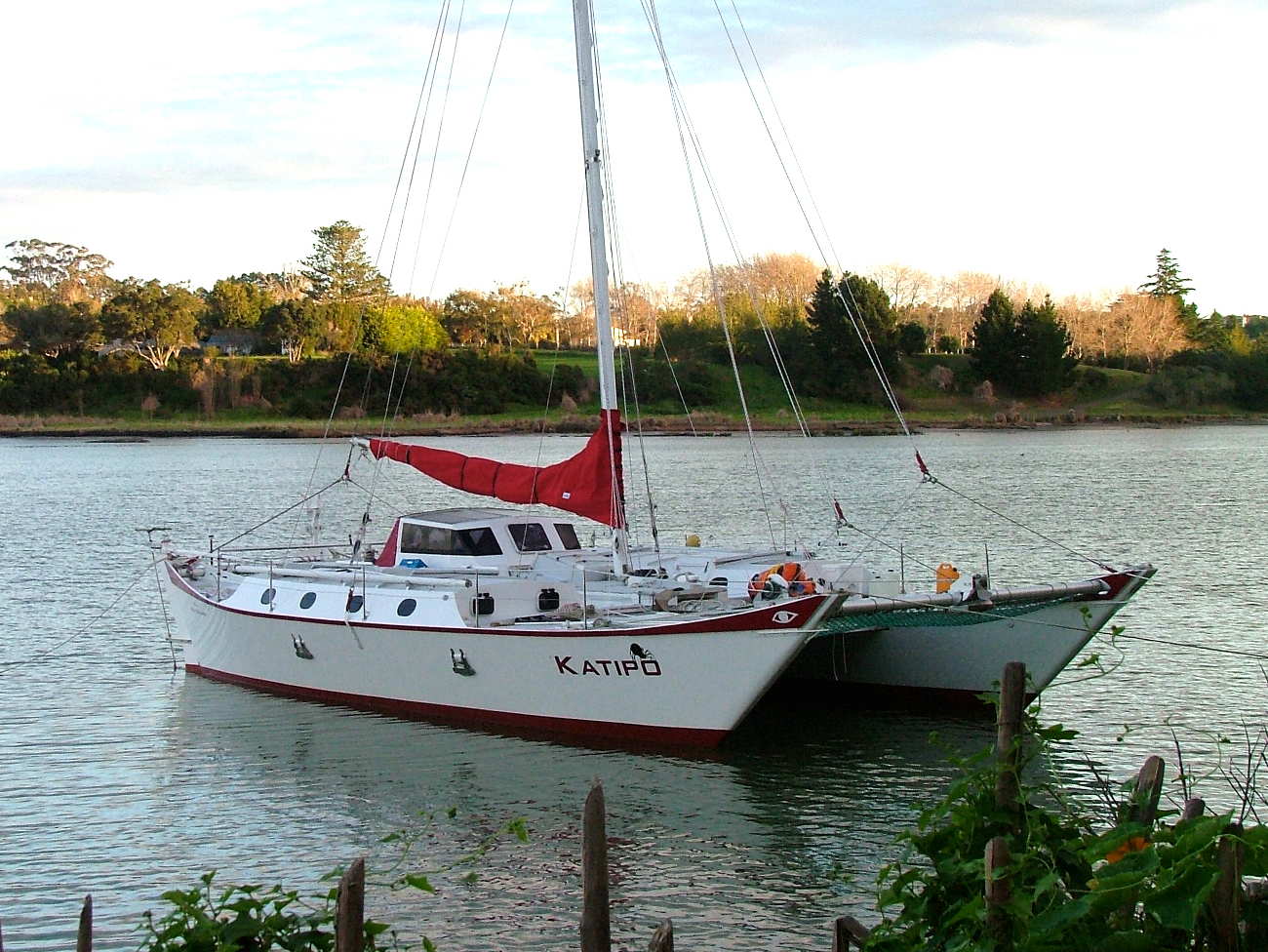 Red and white Narai Mk IV at anchor