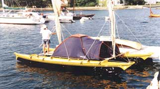 Tahiti Wayfarer double canoe with tent on deck
