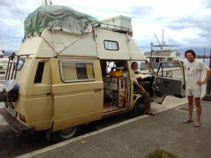 A large campervan on the quay