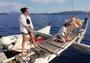 Jamie and Liz on the bow, Liz holding an anchor chain