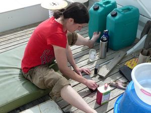 Jen prepares rubber pads for gluing in.
