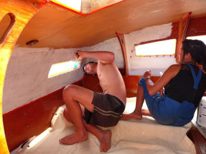 Helpers painting a deckpod cabin