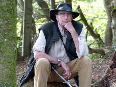 James Wharram sitting in the woods