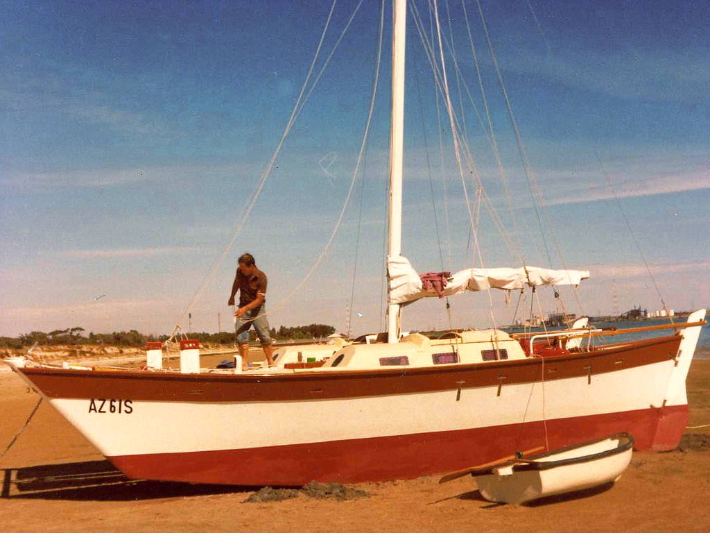 Catamaran on land, one person aboard