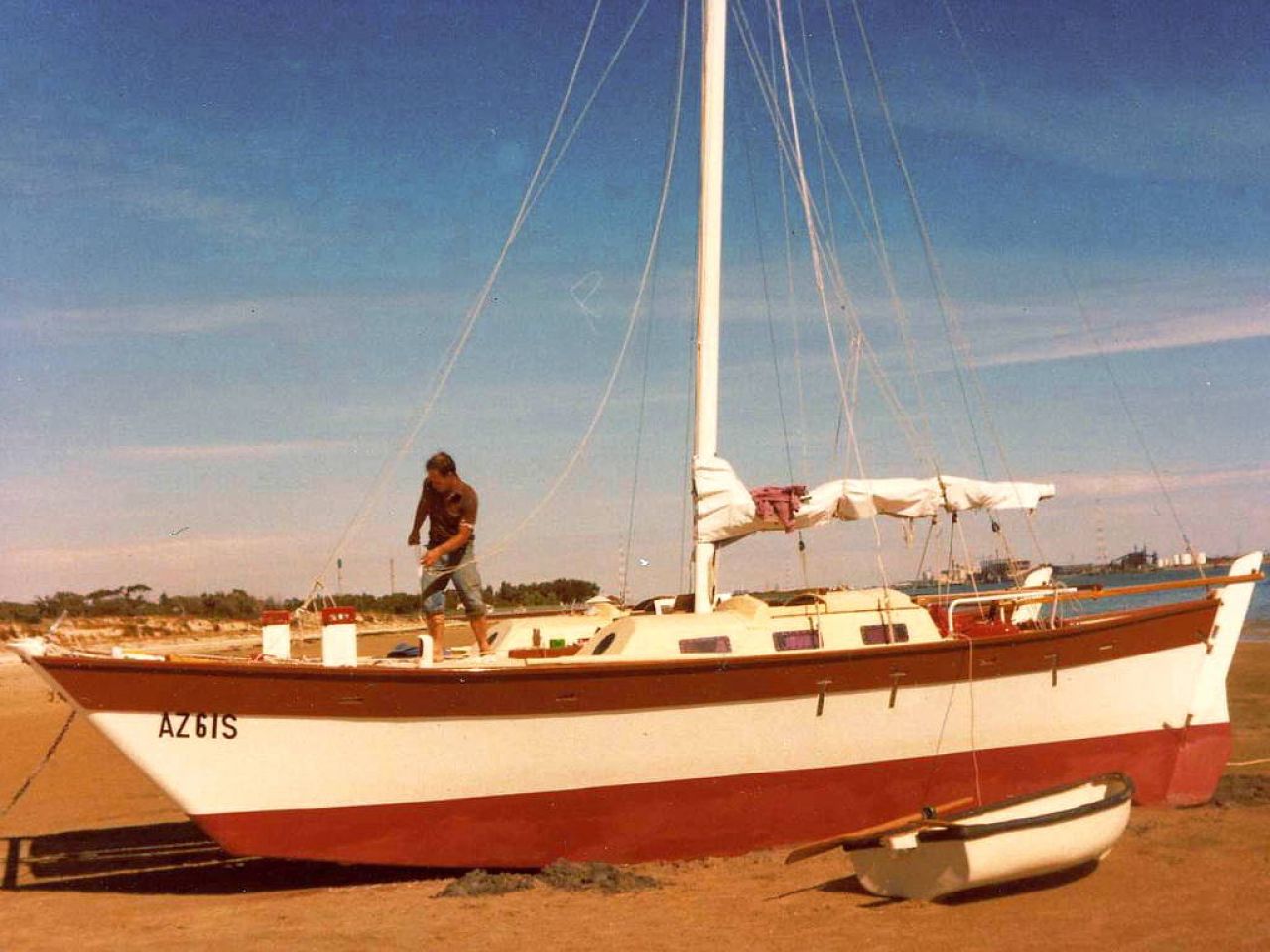 Catamaran on land, one person aboard