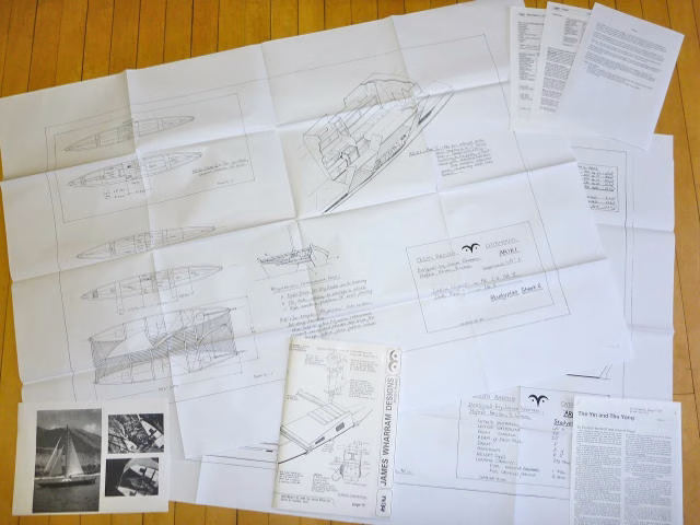 Papers and articles spread out on a surface.