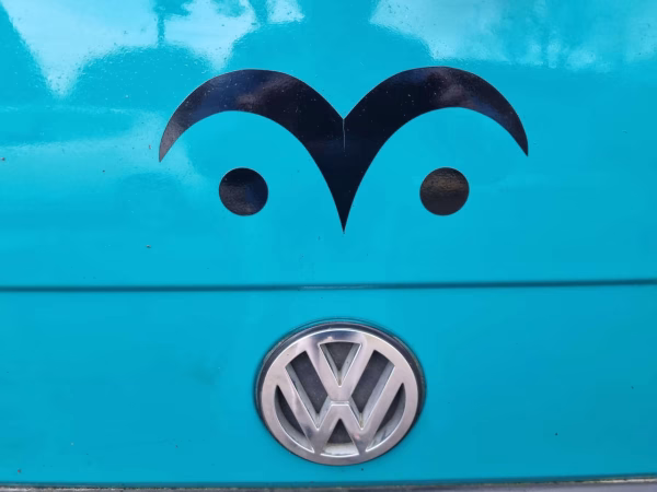Owl eye symbol sticker on a van