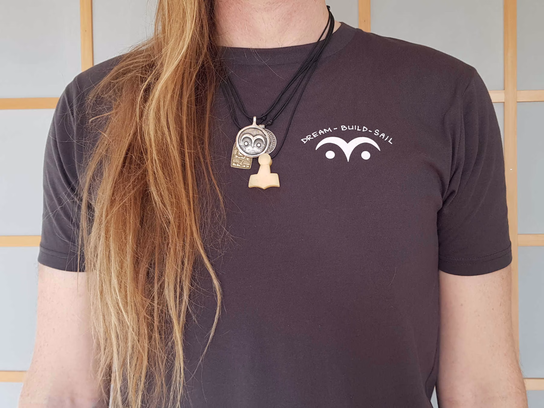 Person wearing T-shirt, facing camera