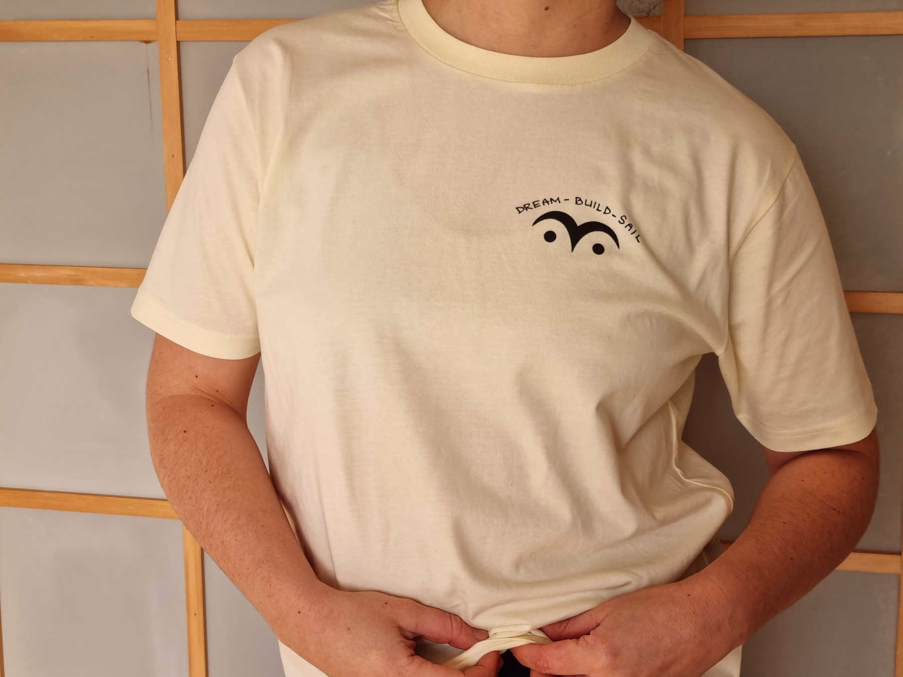 Person wearing white T-shirt, facing camera