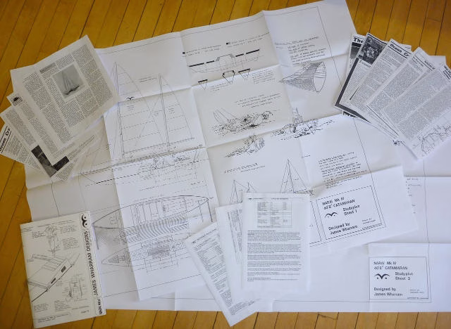 Papers and articles spread out on a surface.