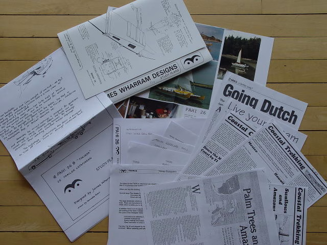 Papers and articles spread out on a surface.