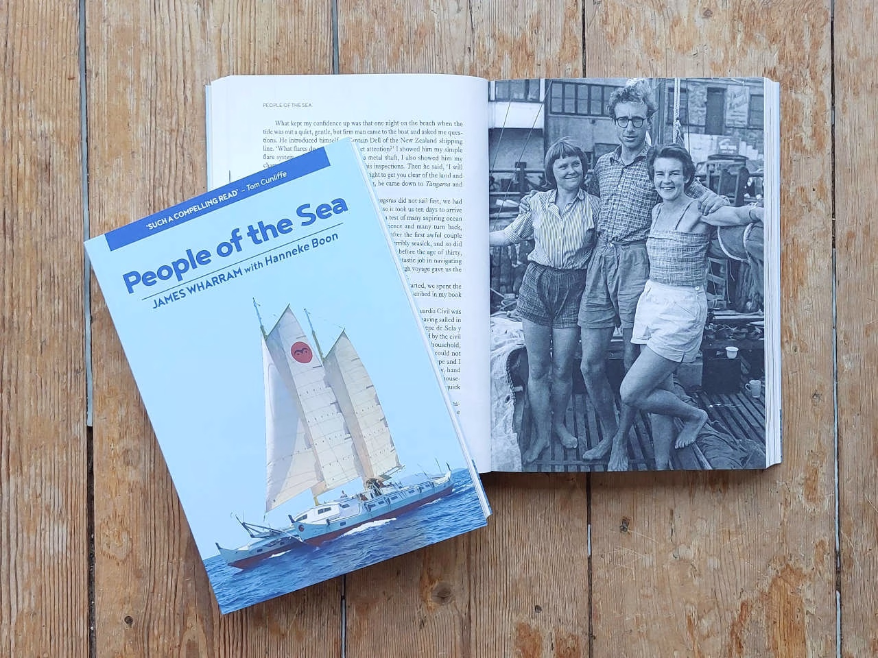 A book called People of the Sea on a wooden surface