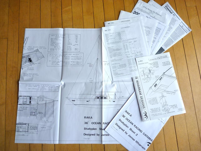 Papers and articles spread out on a surface.