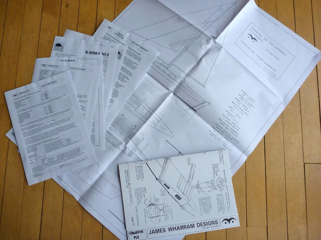 Papers and articles spread out on a surface.