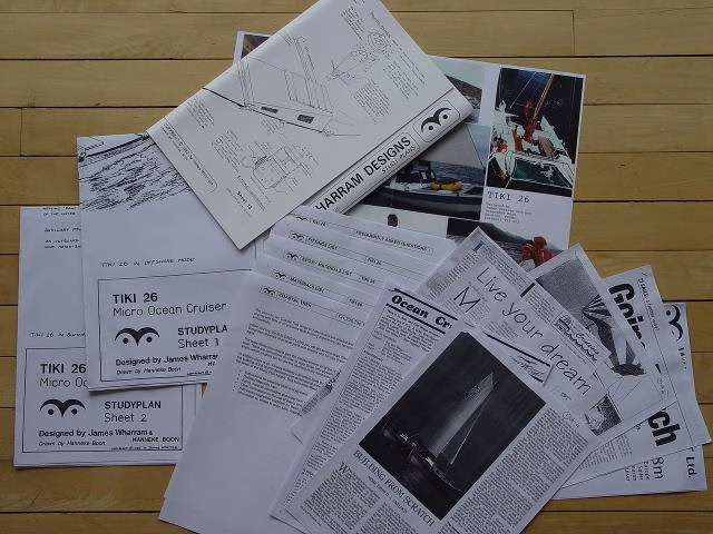 Papers and articles spread out on a surface.