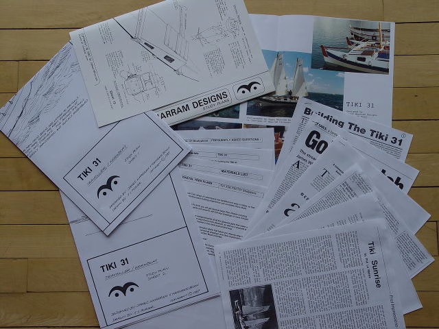 Papers and articles spread out on a surface.