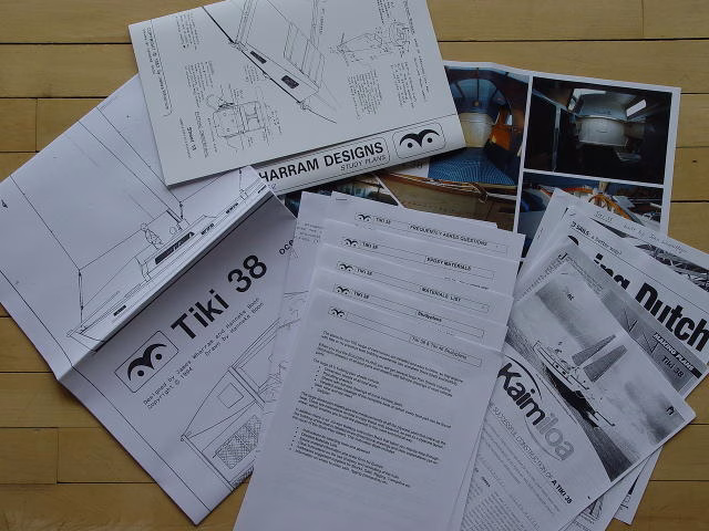 Papers and articles spread out on a surface.