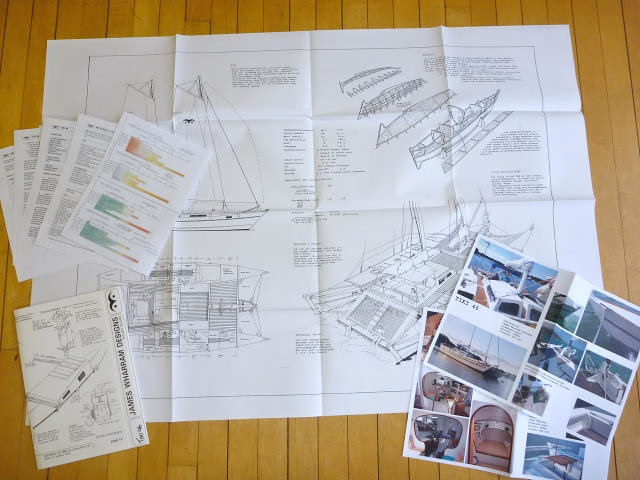 Papers and articles spread out on a surface.